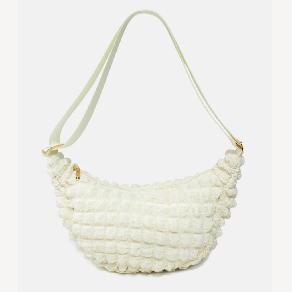Kind Bag crossbody bag in cream waffle texture