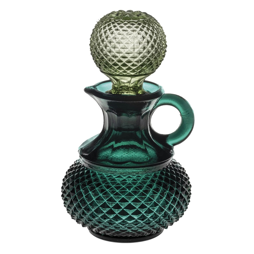 Green glass oil pourer by Vista Alegre with a stopper and a geometric texture