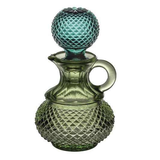 Green glass oil pourer by Vista Alegre with a stopper and a geometric texture