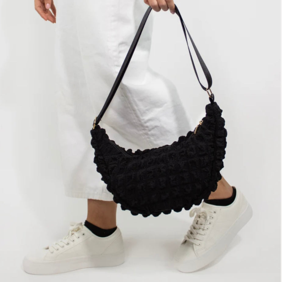Kind Bag crossbody bag in black waffle texture – sustainable recycled fabric with modern minimalist style