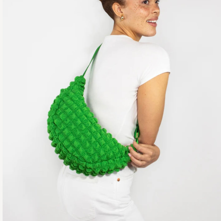 Kind Bag crossbody bag in earthy green waffle fabric – eco-friendly sling bag with tactile texture