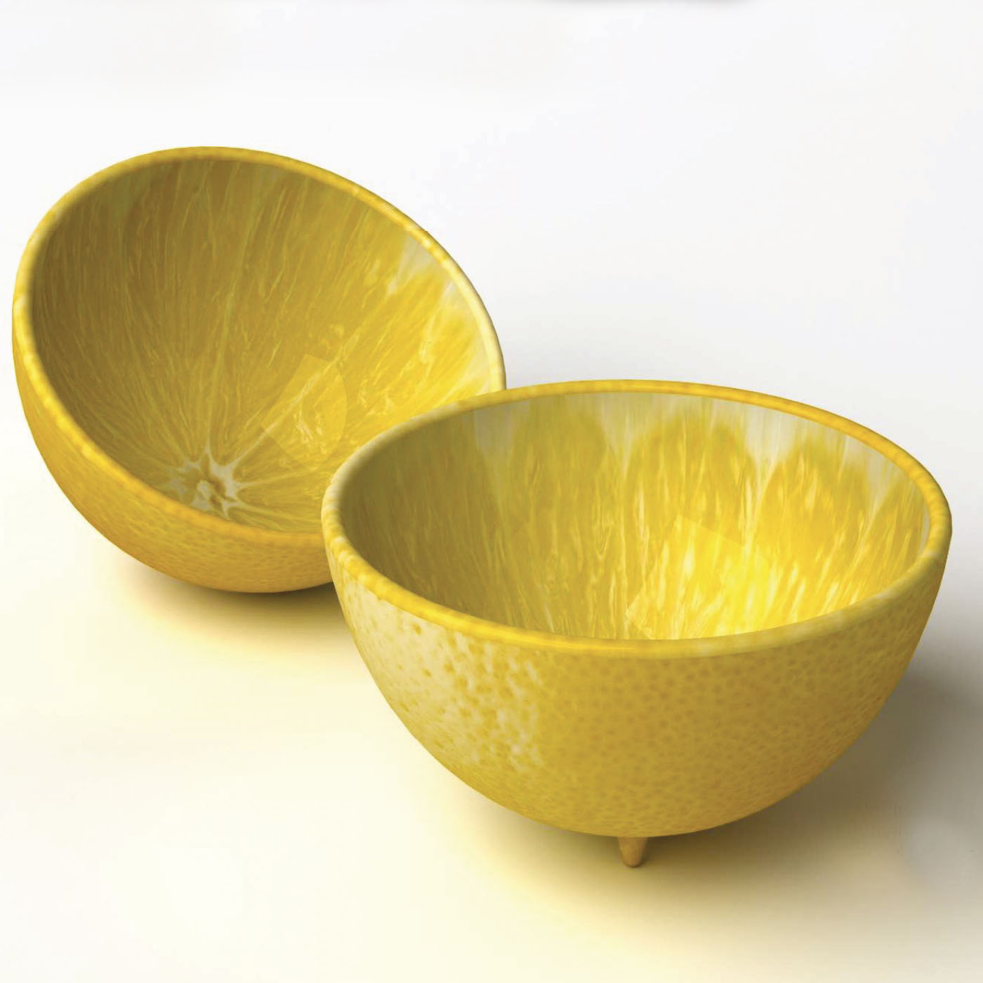 Two yellow ceramic bowls shaped like half lemons by Bordallo Pinheiro with a textured exterior, against a white background.