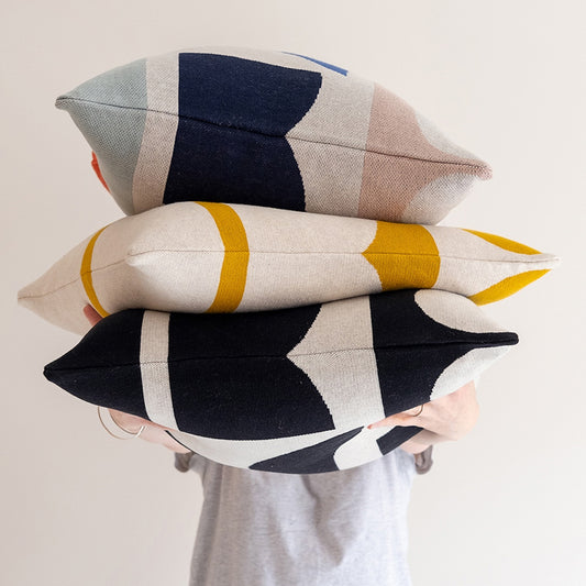 Sophie Home Bruten cushions – bold geometric cotton knit design for modern, colourful home décor - square cushions featuring colours such as navy, beige, pink, yellow, and grey.