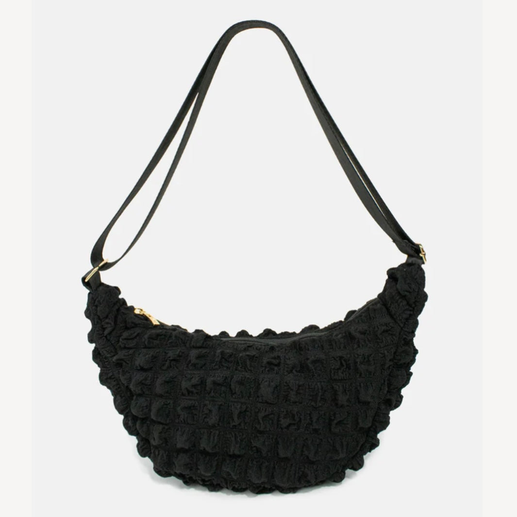 Kind Bag crossbody bag in black waffle texture – sustainable recycled fabric with modern minimalist style