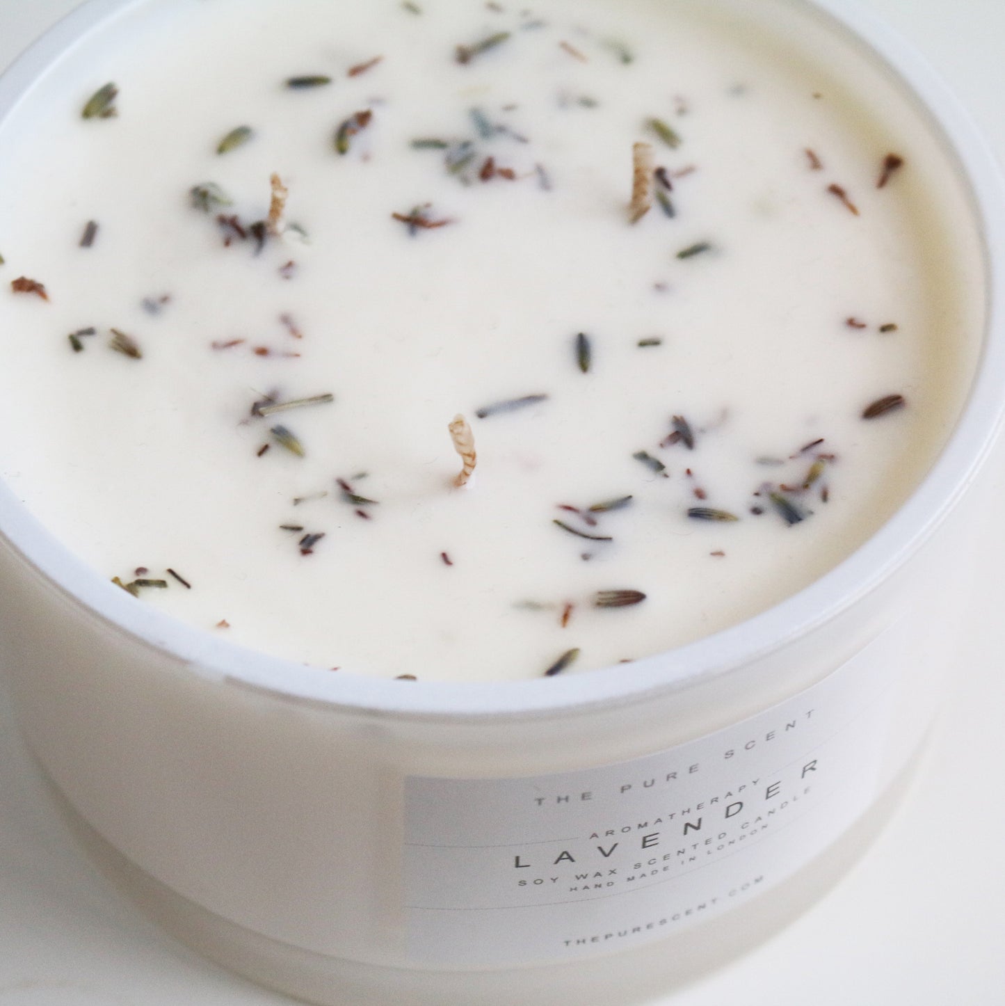 Lavender 3-wick candle by The Pure Scent in white glass with lavender throughout