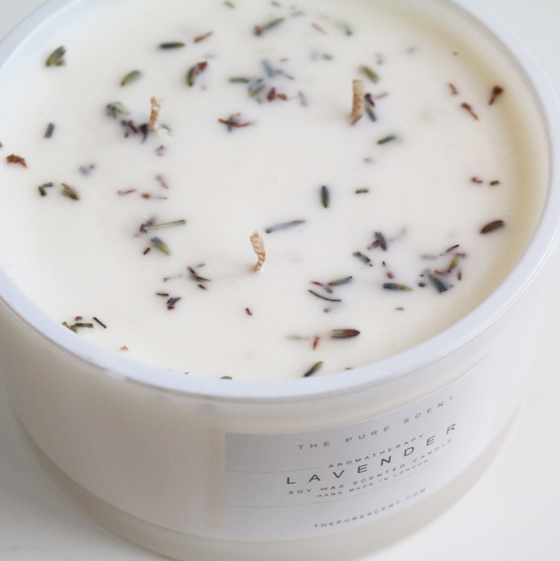 Lavender 3-wick candle by The Pure Scent in white glass with lavender throughout
